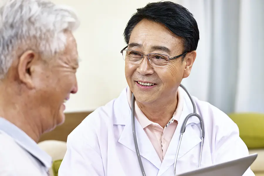 kidney doctor talking with older patient