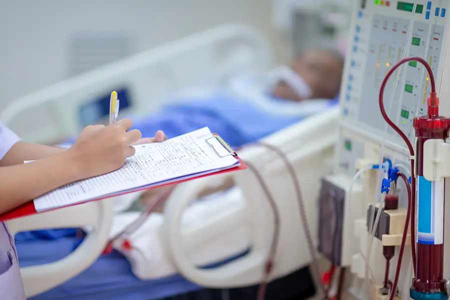 Renal Hypertension being checked by a dialysis nurse